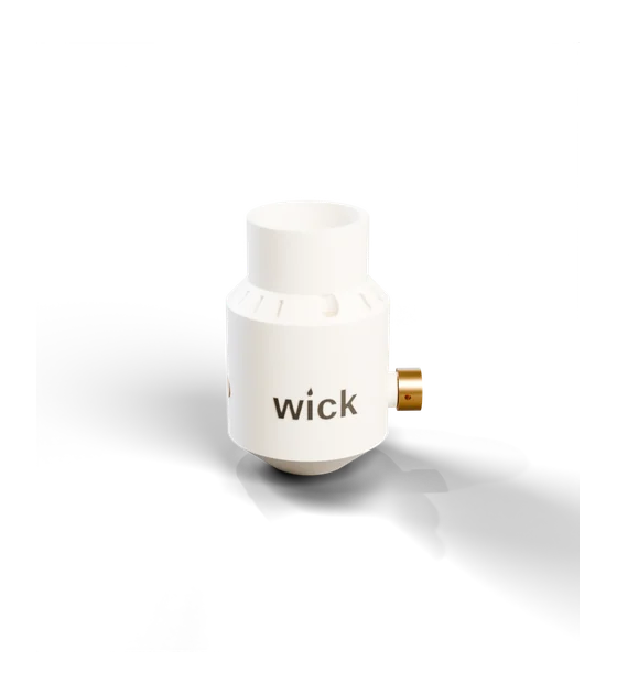 wick in White with a dark wordmark and brass knob